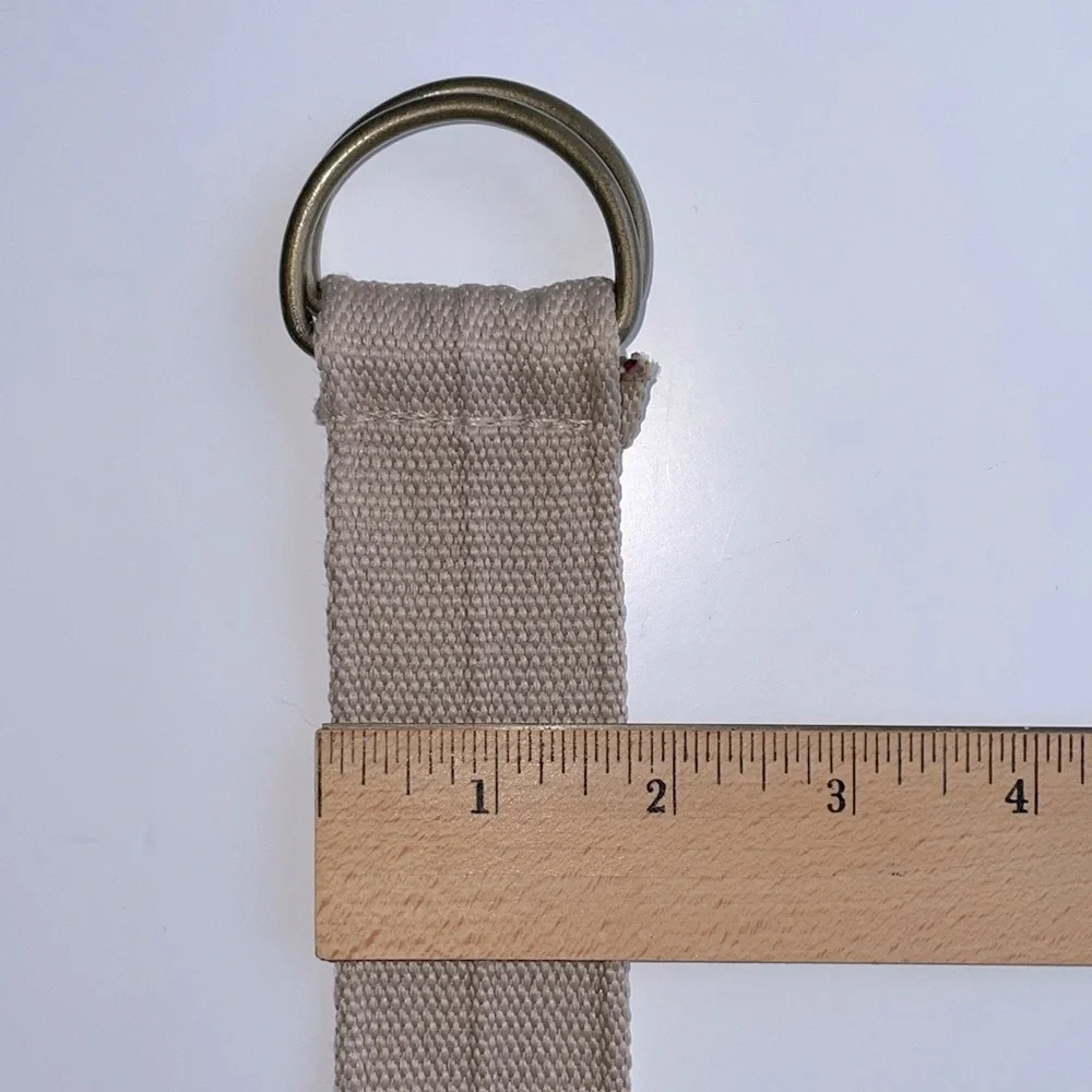 Adjustable light brown woven cotton belt. Matte gold‎ colored buckle. EUC
